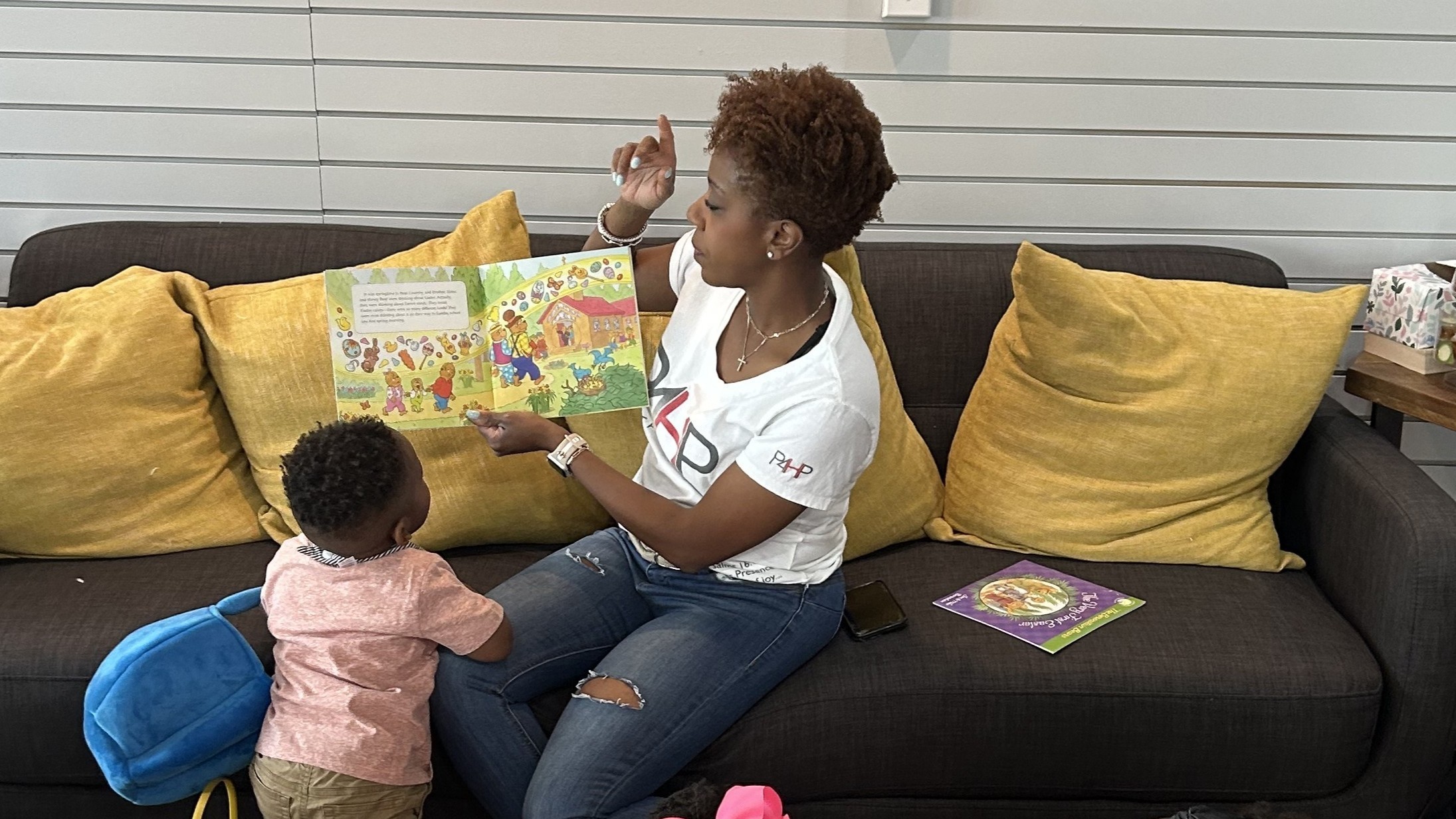 Teacher reading to students at Fruit of the Vine Academy